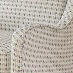 Fauteuil rembourré en tissu multicolore à rayures