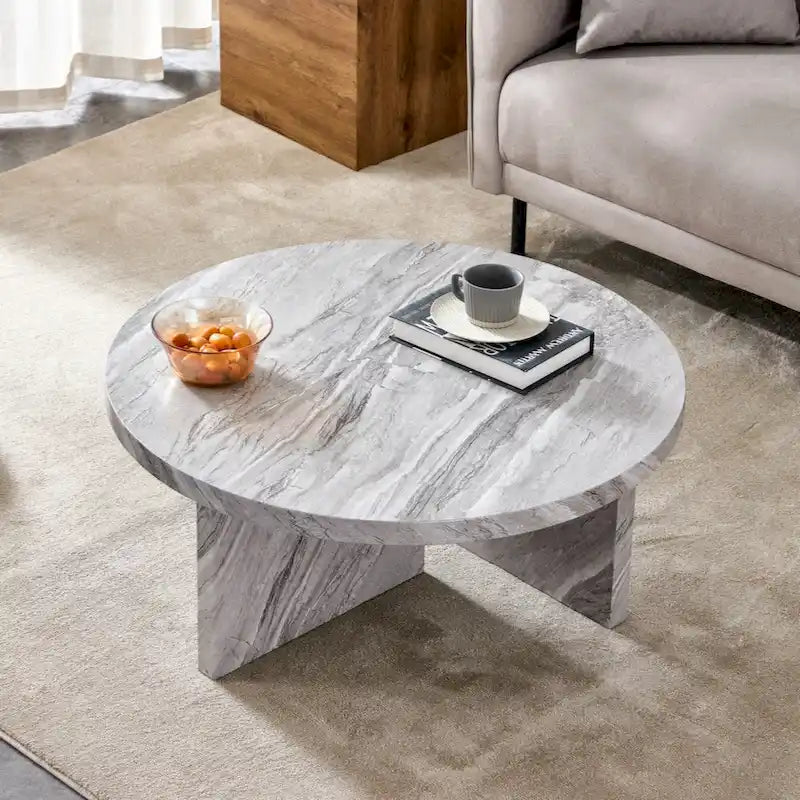 Une table basse ronde en MDF blanc avec motif, adaptée aux petits espaces et aux salons.