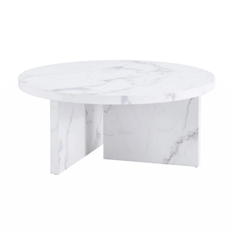 Une table basse ronde en MDF blanc avec motif, adaptée aux petits espaces et aux salons.