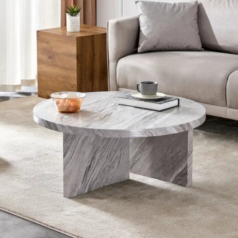 Une table basse ronde en MDF blanc avec motif, adaptée aux petits espaces et aux salons.
