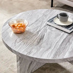 Une table basse ronde en MDF blanc avec motif, adaptée aux petits espaces et aux salons.